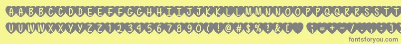 フォントMfLoveIsAwesome2 – 黄色の背景に灰色の文字