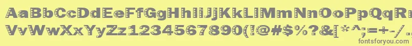 Uncey-fontti – harmaat kirjasimet keltaisella taustalla