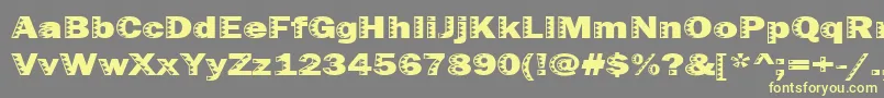 Uncey Font – Yellow Fonts on Gray Background