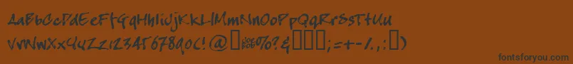 フォントCrapj – 黒い文字が茶色の背景にあります