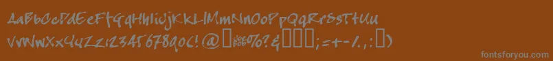 フォントCrapj – 茶色の背景に灰色の文字