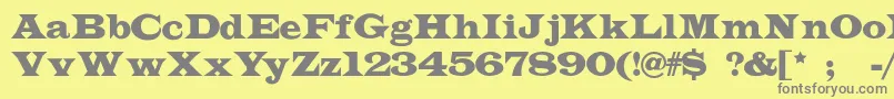 フォントIndubitably – 黄色の背景に灰色の文字