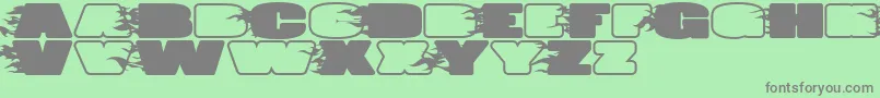 JumboBurnA-fontti – harmaat kirjasimet vihreällä taustalla