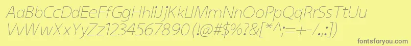KiddysansLightItalic-fontti – harmaat kirjasimet keltaisella taustalla