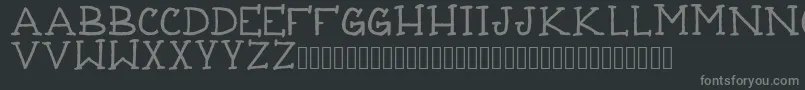 フォントTattooThinline – 黒い背景に灰色の文字