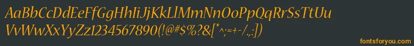 フォントNuevastdItalic – 黒い背景にオレンジの文字