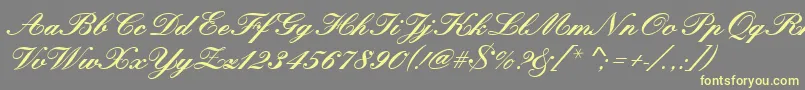 Kunstlerschreibschdbol Font – Yellow Fonts on Gray Background