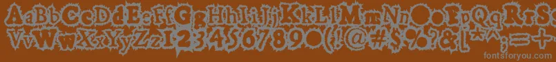 Hoarygaut-Schriftart – Graue Schriften auf braunem Hintergrund
