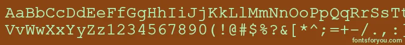 フォントErKurierKoi8R – 緑色の文字が茶色の背景にあります。