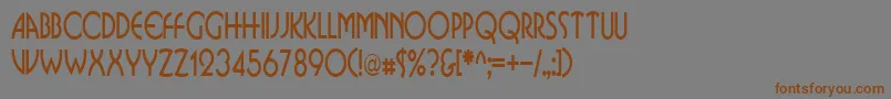 フォントBusinkosqueezedRegular – 茶色の文字が灰色の背景にあります。