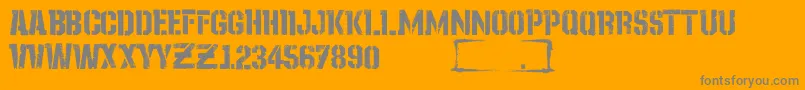 StayOnTheGroundGrunge-fontti – harmaat kirjasimet oranssilla taustalla