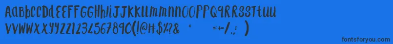 F...SaintTropez Font – Black Fonts on Blue Background