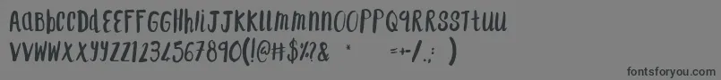 F...SaintTropez Font – Black Fonts on Gray Background