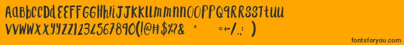 F...SaintTropez Font – Black Fonts on Orange Background