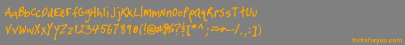 フォントTimtasticHand – オレンジの文字は灰色の背景にあります。