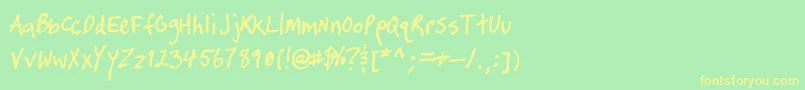 フォントTimtasticHand – 黄色の文字が緑の背景にあります