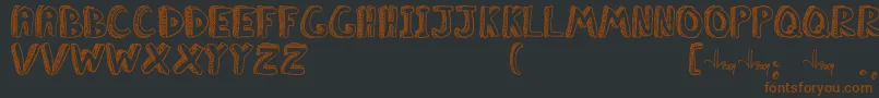 Шрифт ClassboreddomJl – коричневые шрифты на чёрном фоне