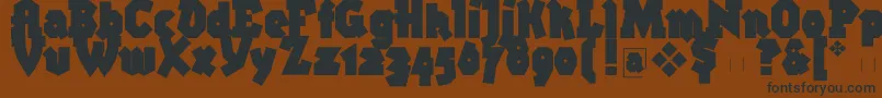 フォントBigbroken – 黒い文字が茶色の背景にあります