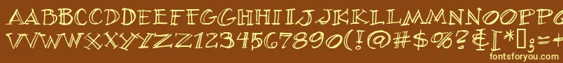 VillageIdiotBb-fontti – keltaiset fontit ruskealla taustalla