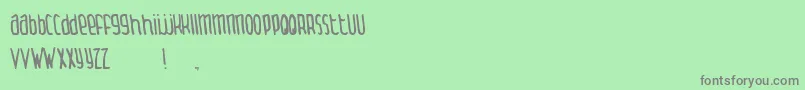 ThingamabobNormal-fontti – harmaat kirjasimet vihreällä taustalla