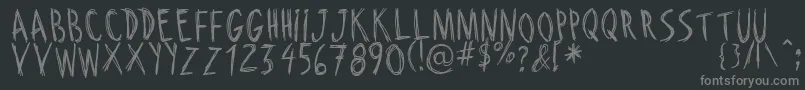RiscadaDoodle-fontti – harmaat kirjasimet mustalla taustalla