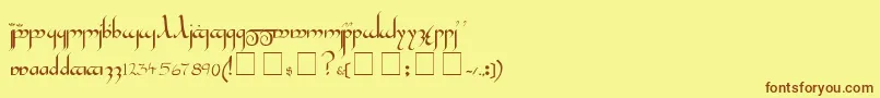 フォントTengwar – 茶色の文字が黄色の背景にあります。