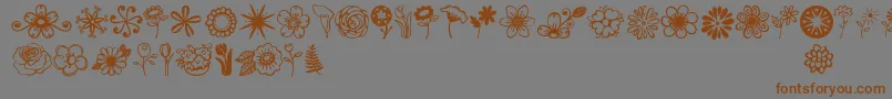 Janda Flower Doodles-Schriftart – Braune Schriften auf grauem Hintergrund