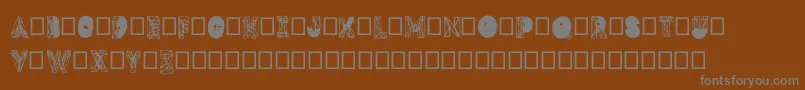 フォントDmesh – 茶色の背景に灰色の文字