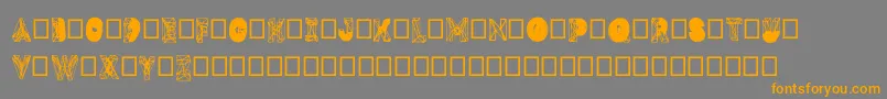 フォントDmesh – オレンジの文字は灰色の背景にあります。