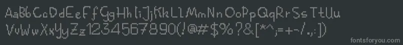 フォントKolquatfunkybitm – 黒い背景に灰色の文字