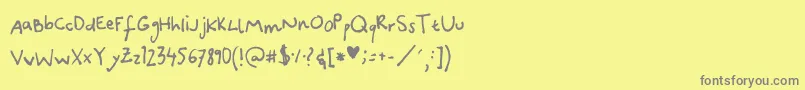 フォントCanidaeHand – 黄色の背景に灰色の文字