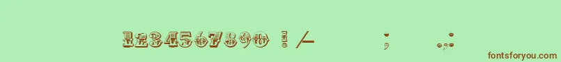 フォントInvest – 緑の背景に茶色のフォント