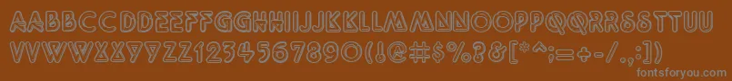QuarkNeonRegular-fontti – harmaat kirjasimet ruskealla taustalla