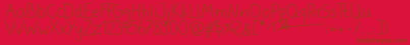 Fonte PhitradesignHandwrittenThin – fontes marrons em um fundo vermelho