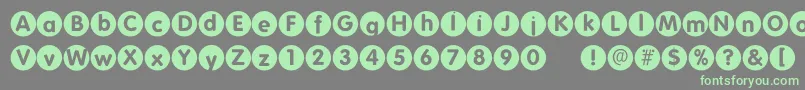 Folkscirclenegative-fontti – vihreät fontit harmaalla taustalla