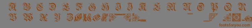フォントTwogriffin – 茶色の文字が灰色の背景にあります。
