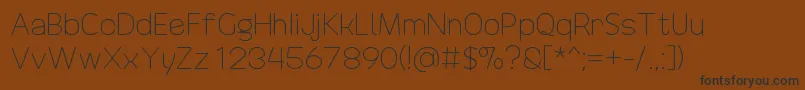 DrakoheartRevofitLight Font – Black Fonts on Brown Background