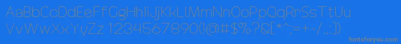 DrakoheartRevofitLight-Schriftart – Graue Schriften auf blauem Hintergrund