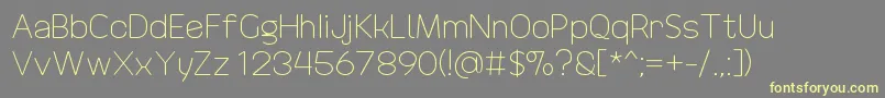 DrakoheartRevofitLight-fontti – keltaiset fontit harmaalla taustalla