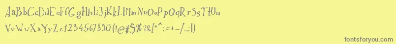 フォントIkusuteito – 黄色の背景に灰色の文字