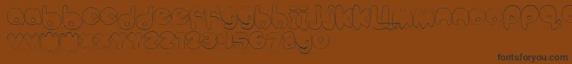 BubbleteaHollow Font – Black Fonts on Brown Background