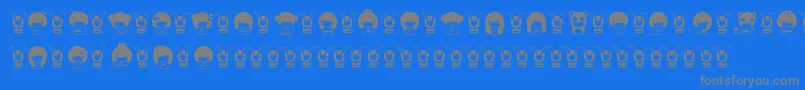 KokeshiKawaii-Schriftart – Graue Schriften auf blauem Hintergrund