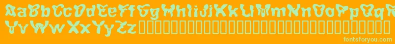 Achten-fontti – vihreät fontit oranssilla taustalla