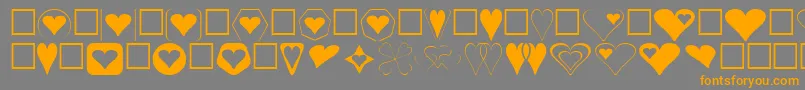 フォントHearts – オレンジの文字は灰色の背景にあります。