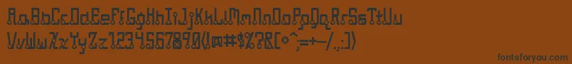 フォントQuasidipitous – 黒い文字が茶色の背景にあります