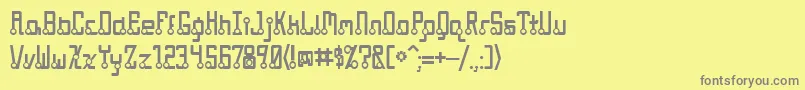 フォントQuasidipitous – 黄色の背景に灰色の文字