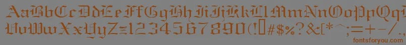 フォントOldenglish – 茶色の文字が灰色の背景にあります。