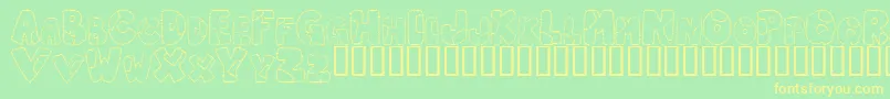 フォントPatcl – 黄色の文字が緑の背景にあります