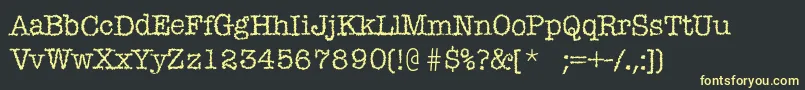 フォントMistica – 黒い背景に黄色の文字