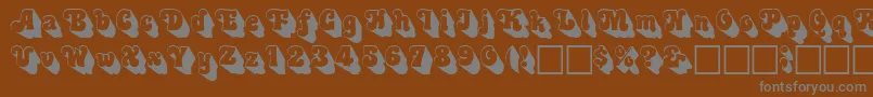 3Dswinger-Schriftart – Graue Schriften auf braunem Hintergrund